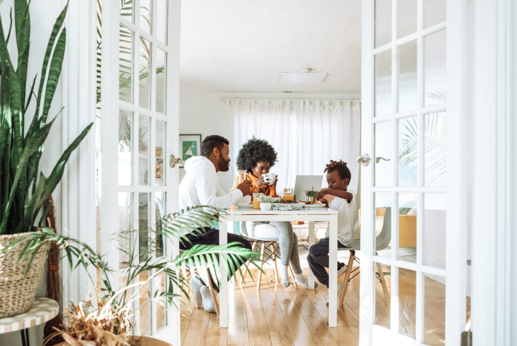 A family gathered around a table talking